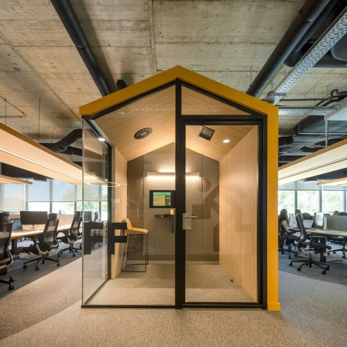 a room with a glass door and some chairs