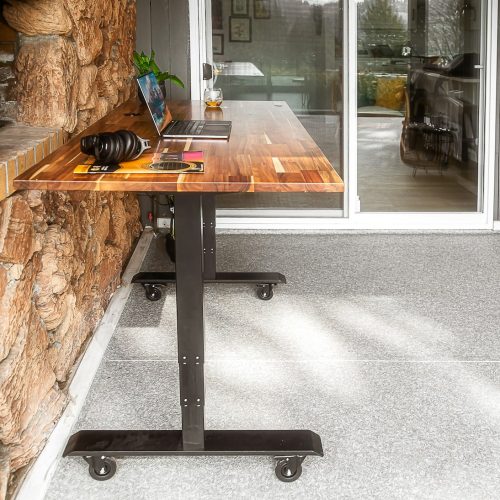 a wooden table with a laptop on top of it